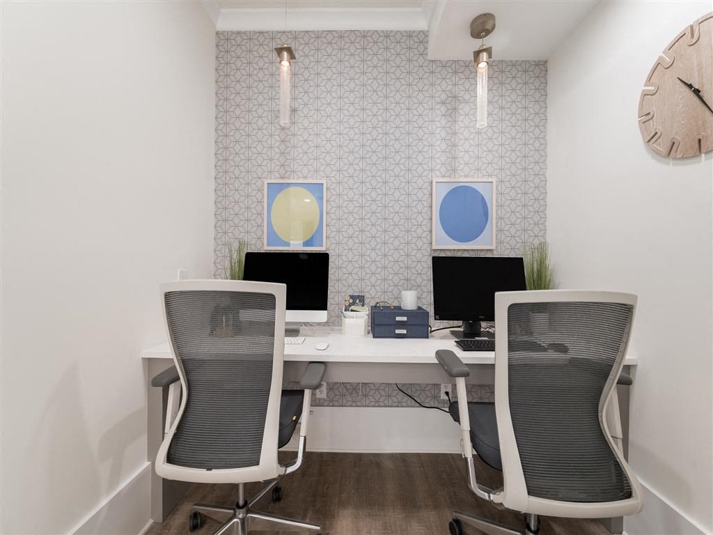 Business center with two computers, work desk, printer and on wall clock at Chace Lake Villas apartments in Birmingham, AL Business center with two computers, work desk, printer and on wall clock at Chace Lake Villas apartments in Birmingham, AL